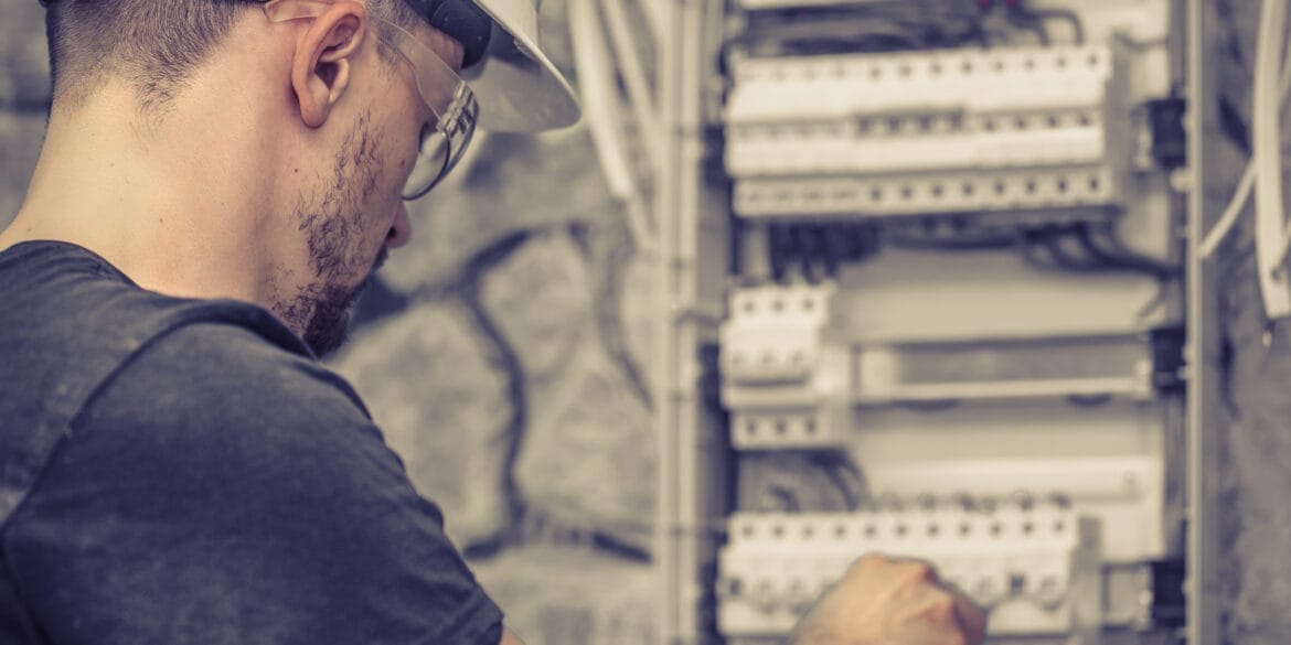 Electrician working on switchboard cables ELEK Software 1170x585 - Save 75 % time and $3,366 using Cable Sizing Software