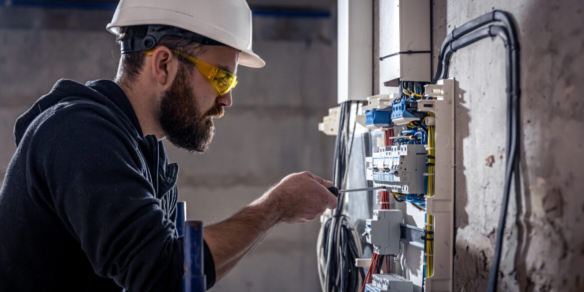 Electrician installing power cable 1170x585 - Articles