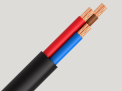 Close-up of three exposed wires encased in black insulation, featuring red, blue, and brown copper conductors.
