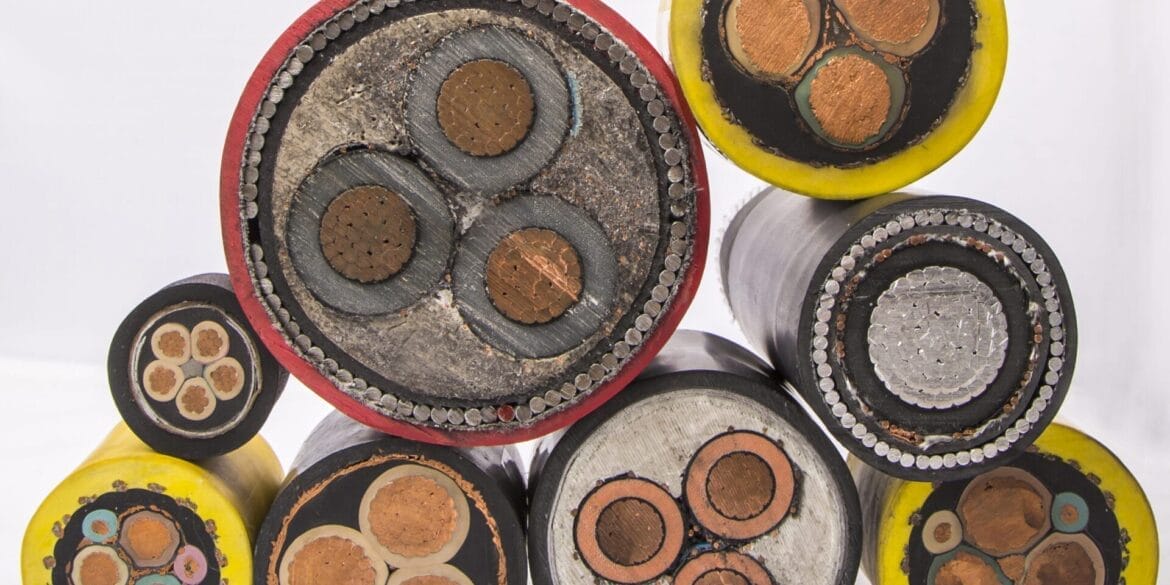 Cross-sections of various electrical cables are displayed, showing multiple copper conductors and insulation layers in different sizes and colors against a white background.